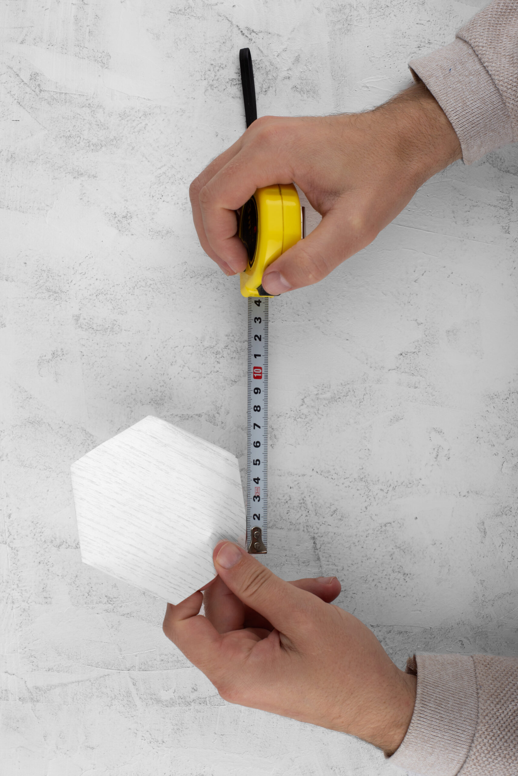 top-view-hands-measuring-decorative-vinyl